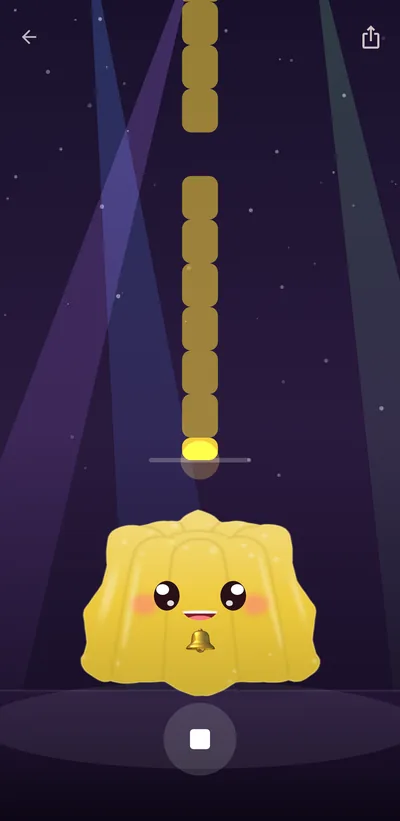 A jelly performing on the spotlit stage